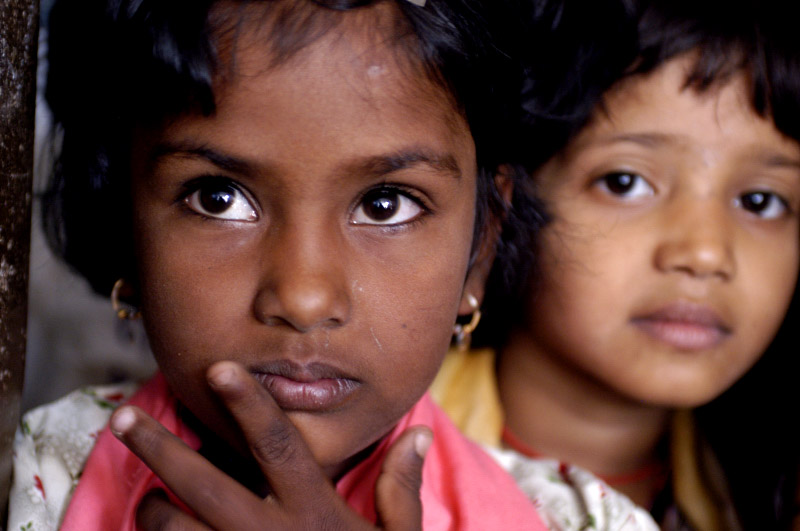 Two young girls smiling at the camera