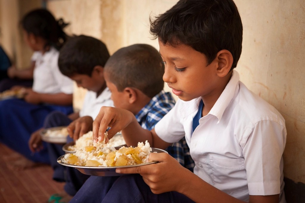 Schoolboys enjoying a nutritious midday meal