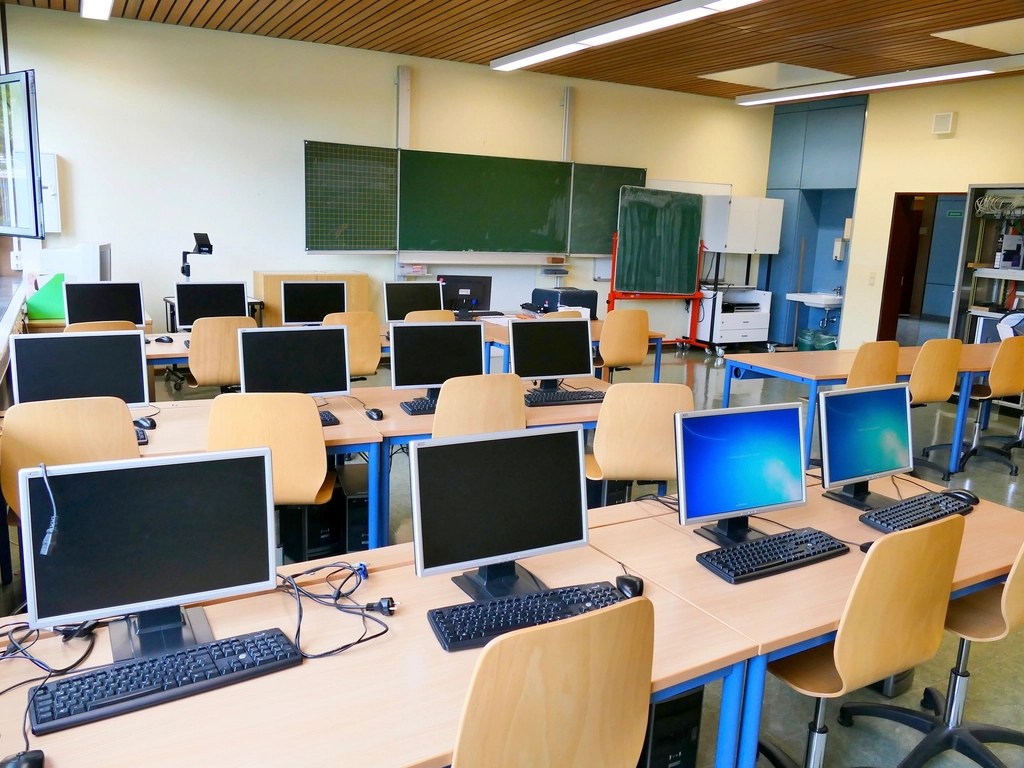 Computer lab with rows of desktop computers for skill training